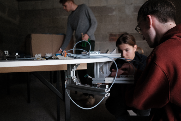 Members of the project team assembling the scales with the game table