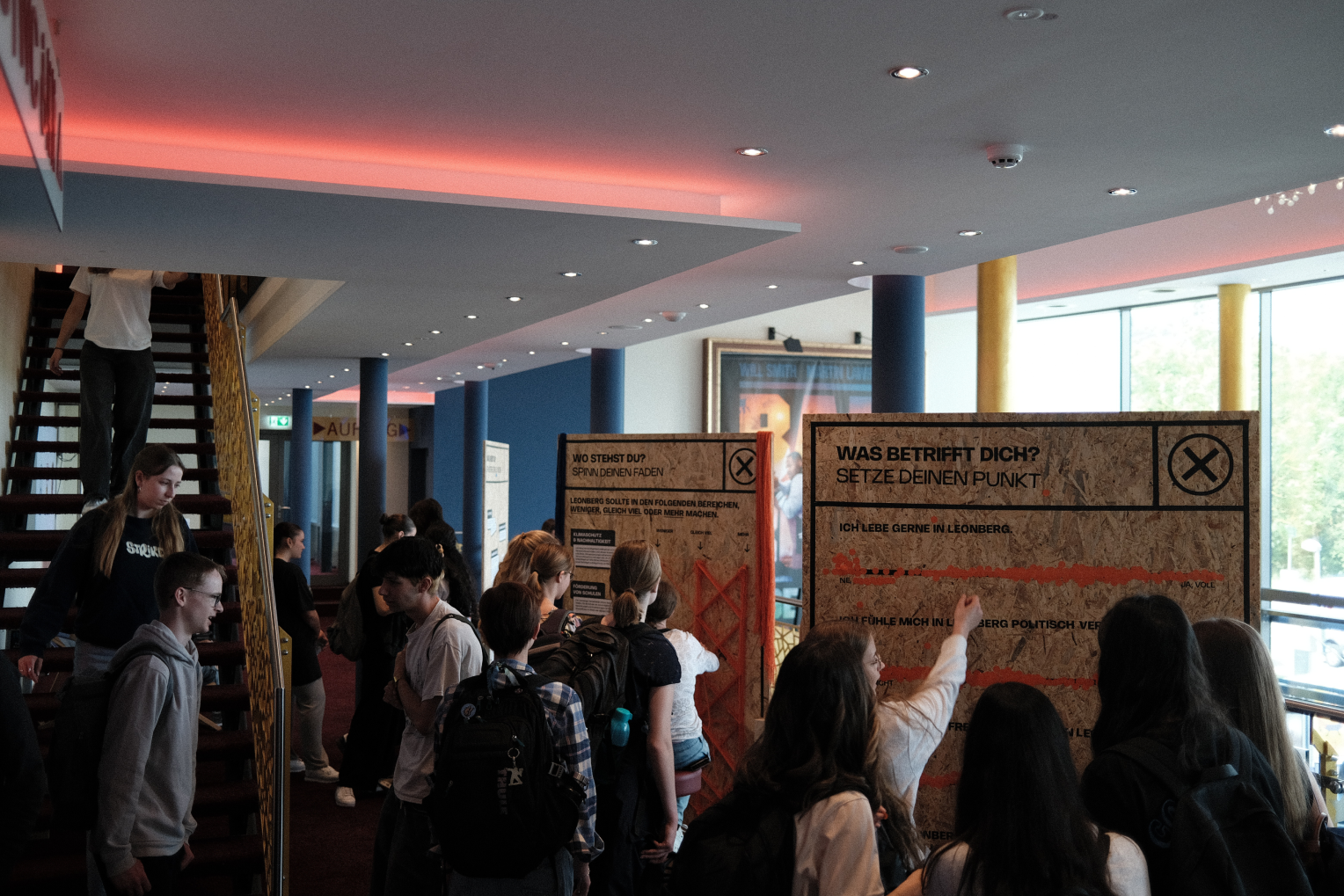 Students in front of the wooden exhibition stations