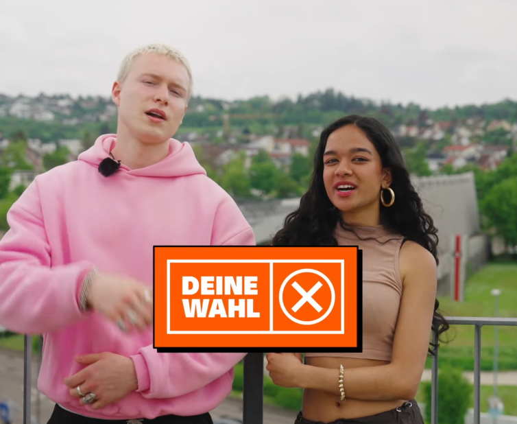 Still form the film showing a boy and a girl moderating into the camera